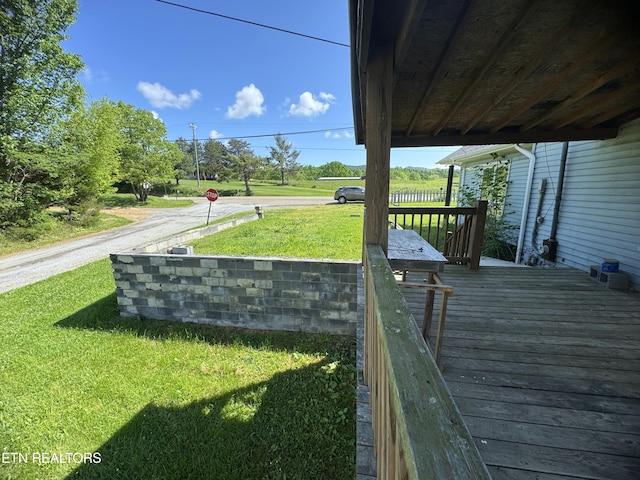 deck featuring a yard