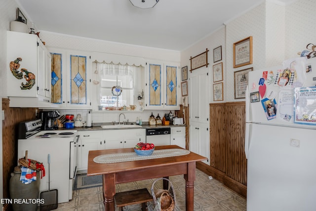 kitchen featuring white cabinets, sink, white appliances, and light tile flooring