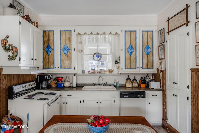 kitchen with white appliances, white cabinetry, ornamental molding, sink, and tasteful backsplash