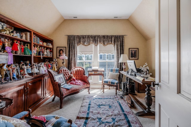 carpeted office space featuring lofted ceiling