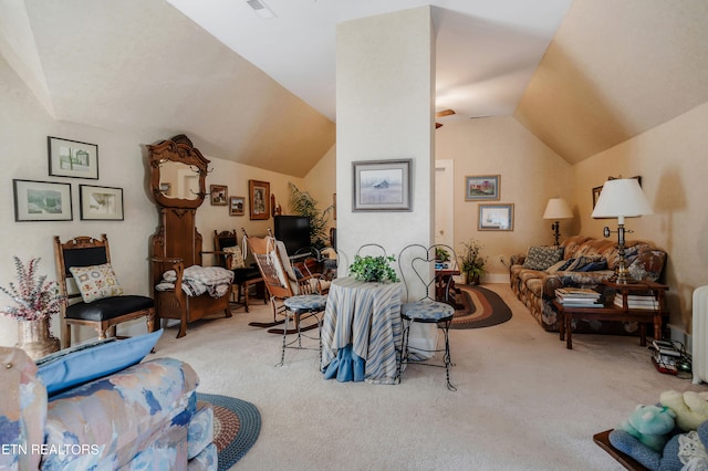 interior space with lofted ceiling and carpet