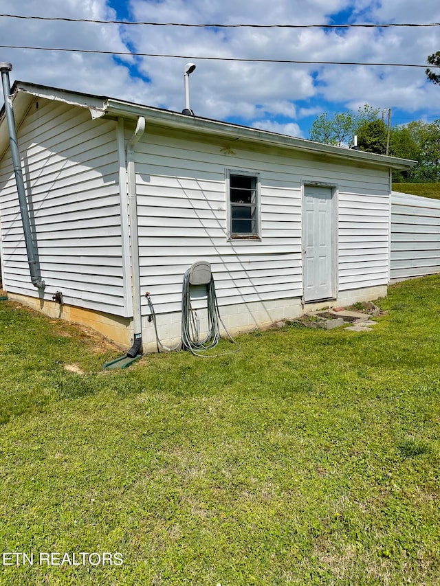 view of property exterior with a yard