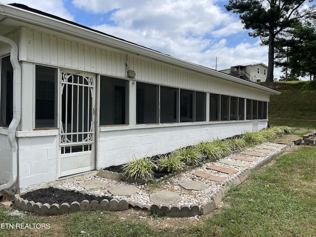 view of home's exterior featuring a sunroom