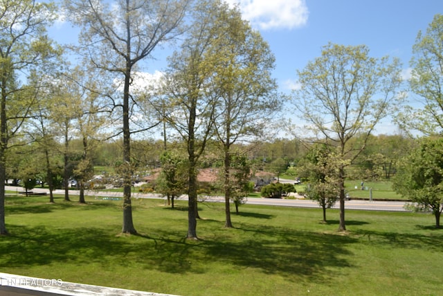 surrounding community featuring a lawn