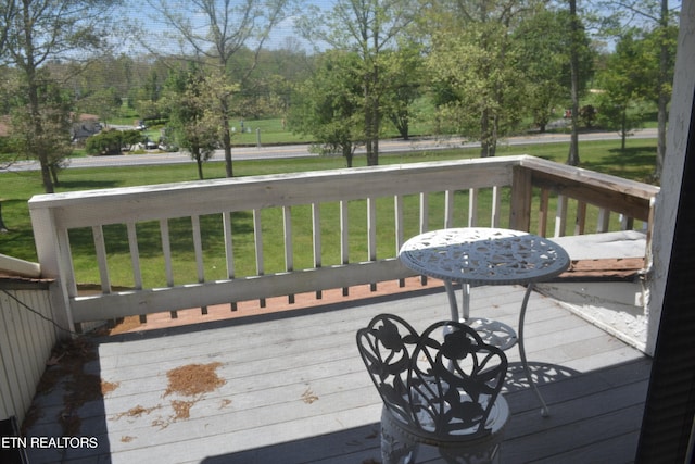 deck featuring a lawn