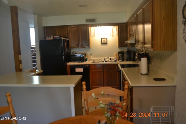 kitchen featuring sink and black appliances