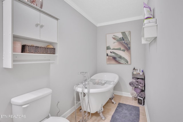 bathroom featuring ornamental molding, toilet, tile floors, and a textured ceiling