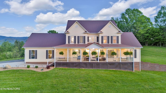 view of front of home with a front lawn and a porch