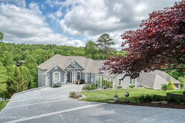 view of front of home with a front yard