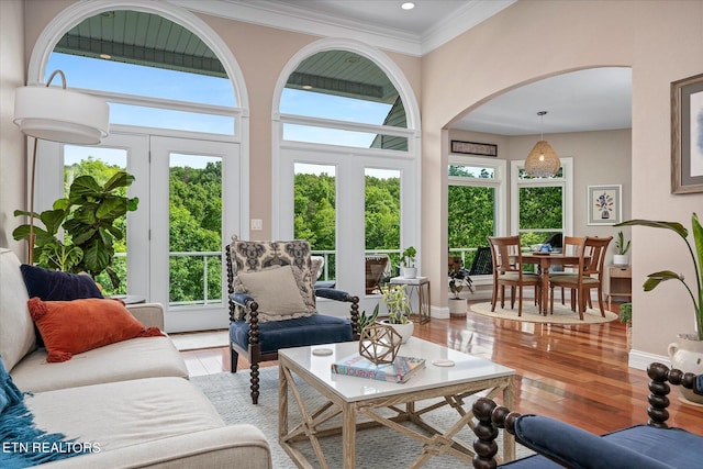 interior space featuring french doors, a high ceiling, and hardwood / wood-style flooring