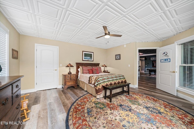 bedroom featuring ceiling fan and hardwood / wood-style floors