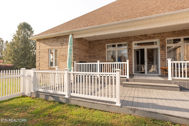 back of property featuring a wooden deck