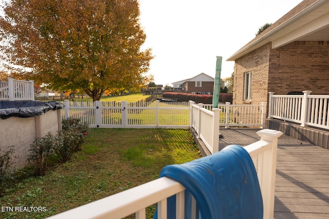 view of yard featuring a pool side deck