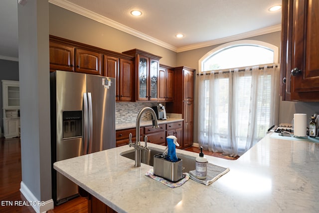 kitchen featuring ornamental molding, dark wood-type flooring, and stainless steel refrigerator with ice dispenser