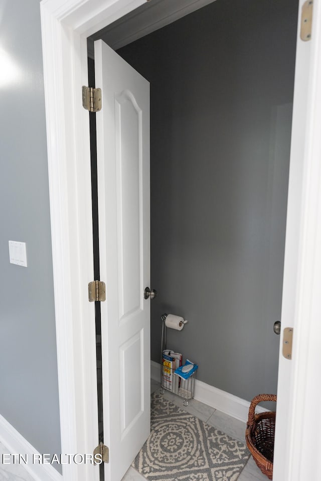 bathroom with tile patterned floors