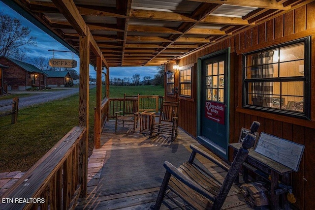 deck at dusk with a yard