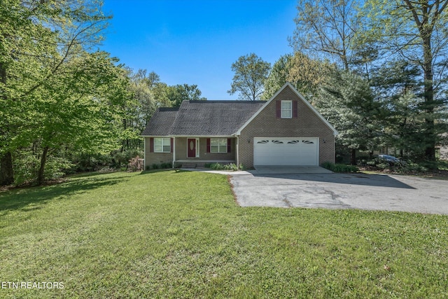 view of front of property featuring a garage and a front lawn