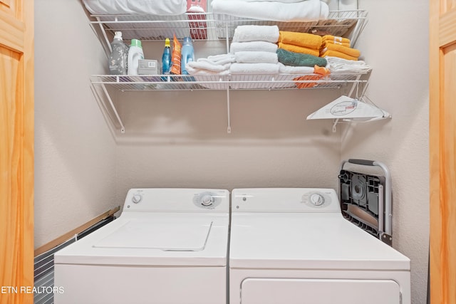 laundry room with washing machine and dryer