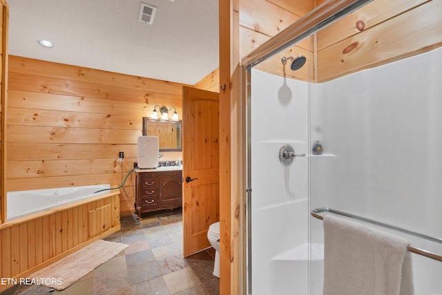 full bathroom featuring wood walls, toilet, tile flooring, vanity, and shower with separate bathtub