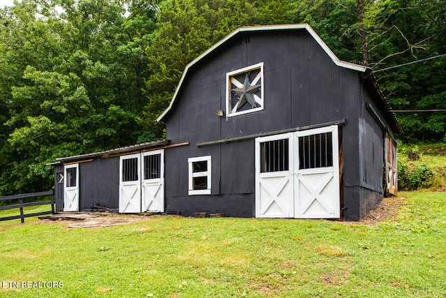 exterior space with a front lawn and an outdoor structure