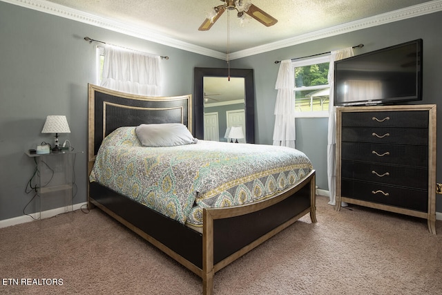 carpeted bedroom featuring ornamental molding, ceiling fan, and a textured ceiling