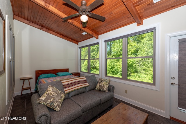 bedroom with wood ceiling, ceiling fan, vaulted ceiling with beams, and dark tile floors