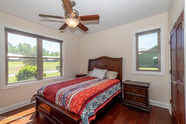 bedroom featuring ceiling fan and dark hardwood / wood-style floors