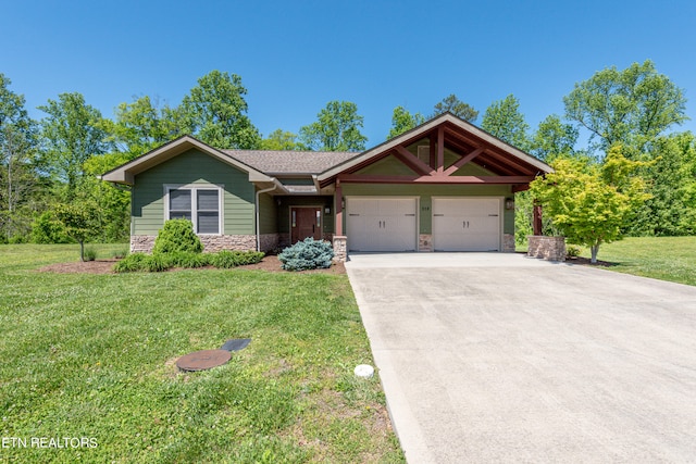 view of front of home with a garage and a front yard