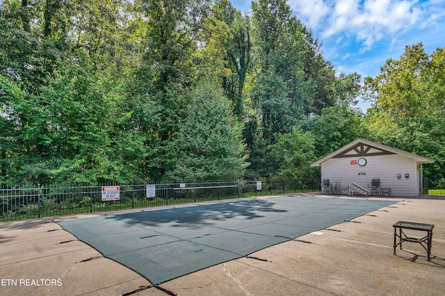 view of swimming pool with a patio area