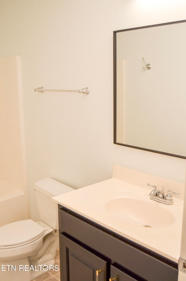 bathroom featuring vanity and toilet