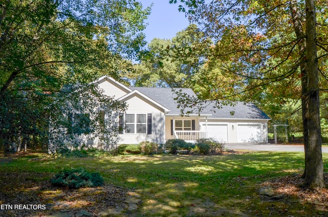 view of front of home featuring a garage and a front lawn