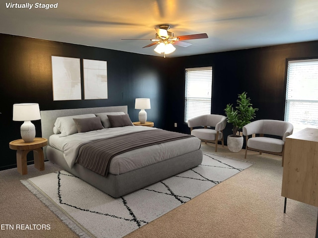 bedroom featuring carpet flooring, ceiling fan, and wood walls