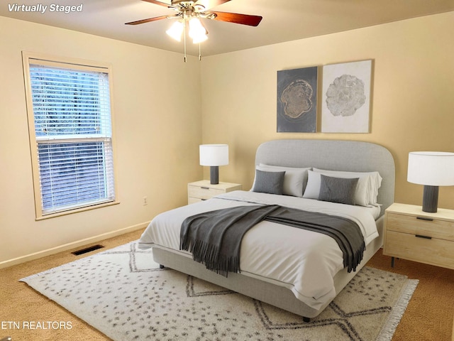 bedroom featuring ceiling fan and carpet floors