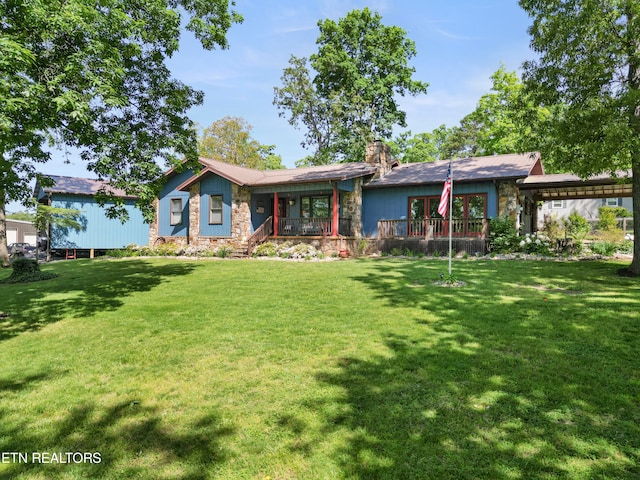 single story home with a front lawn