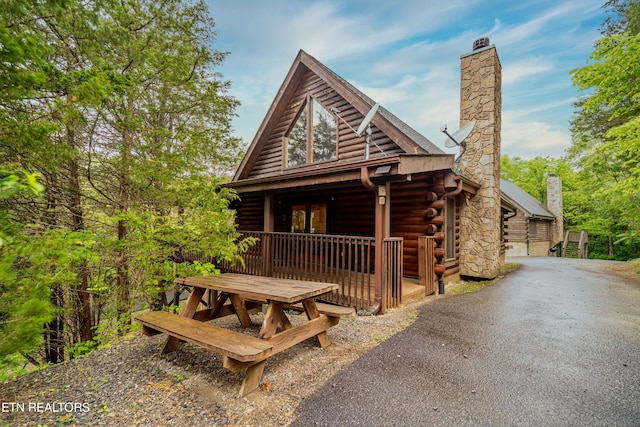 cabin featuring a porch