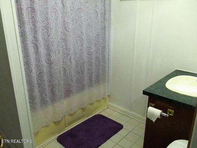 bathroom featuring vanity and tile flooring