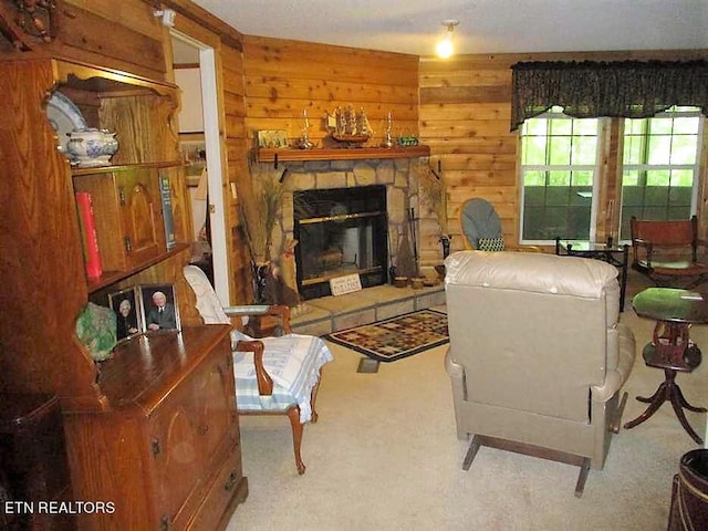 living room with a fireplace and carpet floors