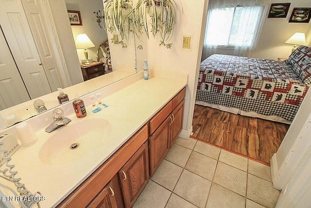 bathroom with wood-type flooring and vanity