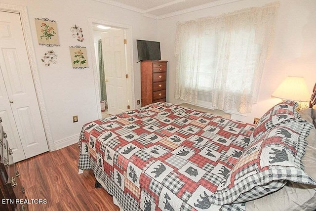 bedroom featuring dark hardwood / wood-style flooring and crown molding