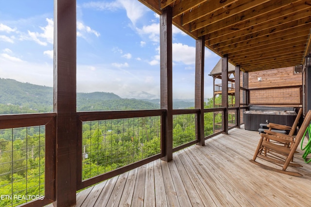 wooden deck with a mountain view