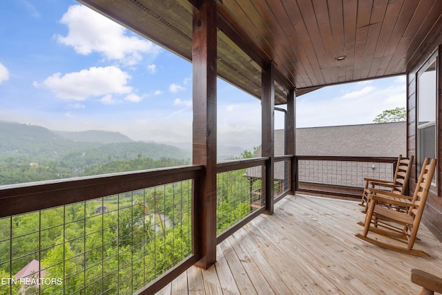 wooden deck featuring a mountain view