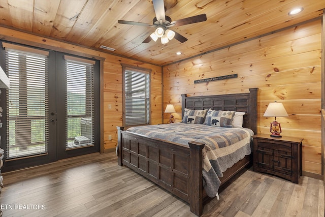 bedroom with access to outside, light hardwood / wood-style floors, wood ceiling, and ceiling fan