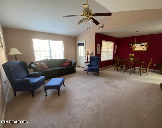 carpeted living room with high vaulted ceiling and ceiling fan