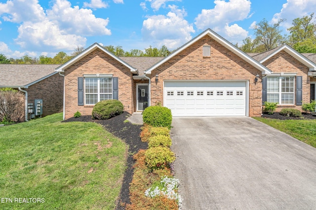 ranch-style house featuring an attached garage, a front lawn, brick siding, and concrete driveway