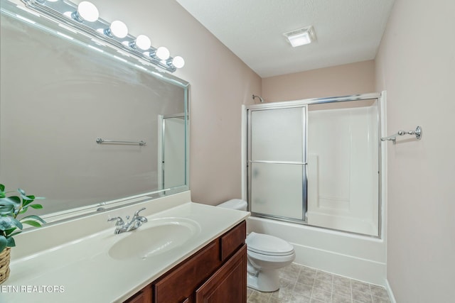 full bath with visible vents, combined bath / shower with glass door, vanity, and toilet