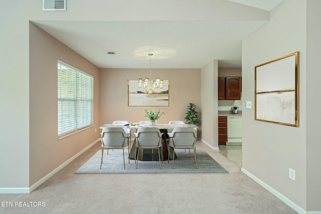 dining space featuring baseboards, visible vents, an inviting chandelier, and light colored carpet
