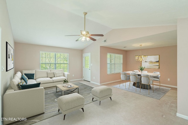 living area with carpet, vaulted ceiling, visible vents, baseboards, and ceiling fan with notable chandelier