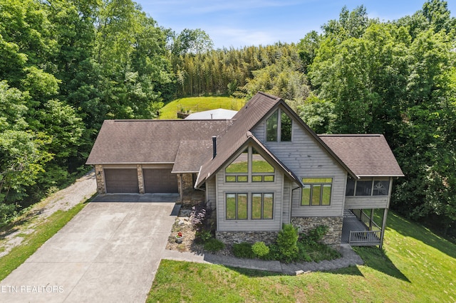 view of front of house with a front lawn and a garage