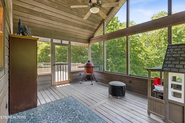 sunroom featuring wooden ceiling, lofted ceiling, and ceiling fan