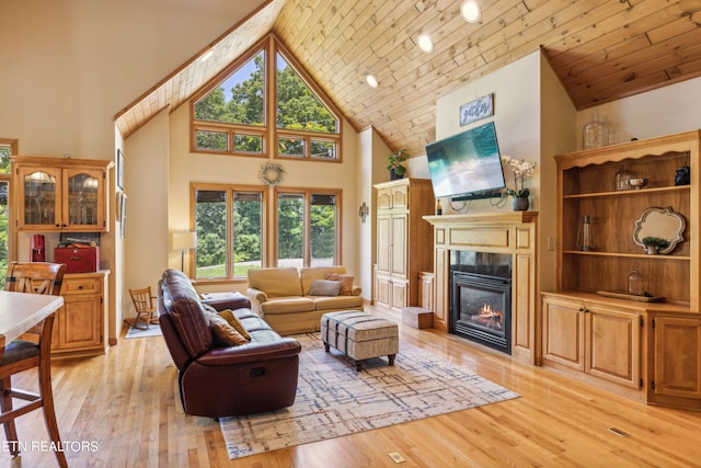 living room with high vaulted ceiling, wooden ceiling, and light wood-type flooring